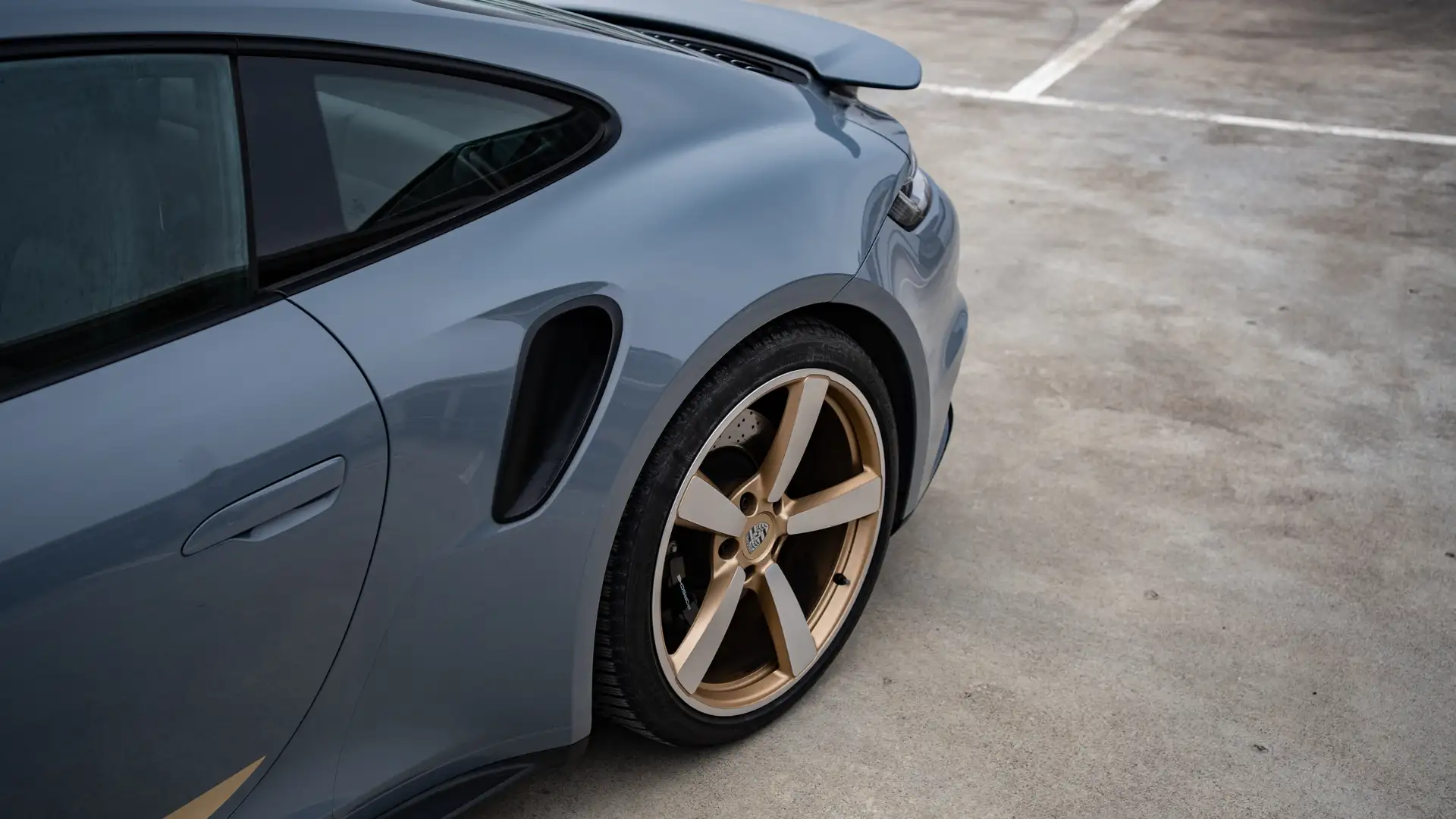 The rear of our Porsche 911 Turbo with air intake photographed from the side.